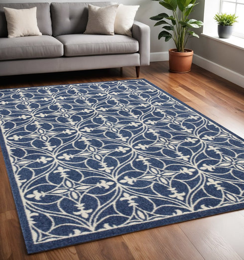 5' X 8' Blue And Ivory Floral Medallion Area Rug