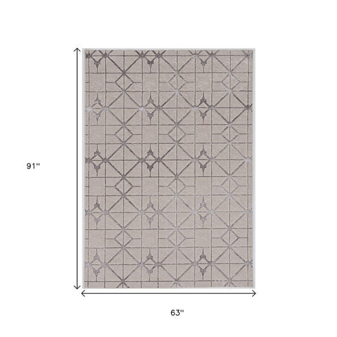 5' X 8' Ivory And Brown Geometric Area Rug
