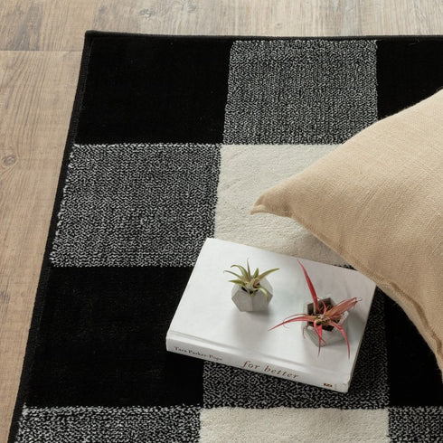 7' X 9' Black And Ivory Gingham Area Rug