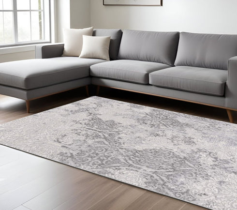 8' X 11' Cream And Gray Tinted Ogee Pattern Area Rug