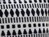 22" Black and White Southwestern Cotton Blend Throw Pillow With Tassels