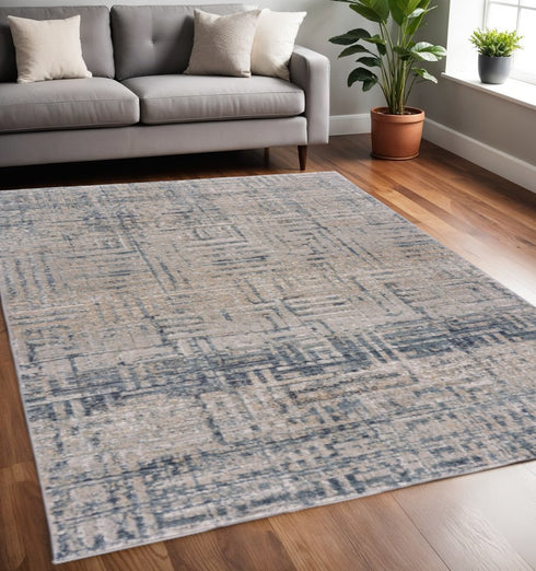 8' X 11' Cream Blue And Ivory Geometric Distressed Stain Resistant Area Rug