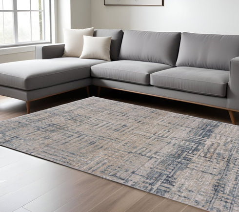 8' X 11' Cream Blue And Ivory Geometric Distressed Stain Resistant Area Rug