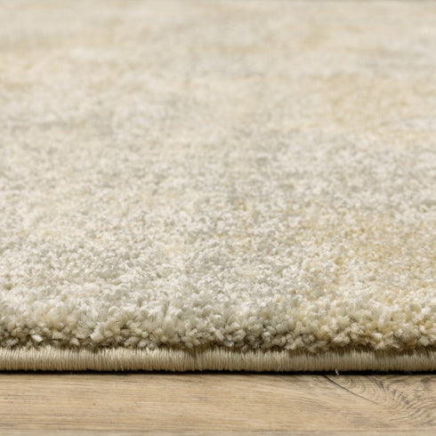 8' X 11' Grey Ivory Beige And Taupe Abstract Power Loom Stain Resistant Area Rug