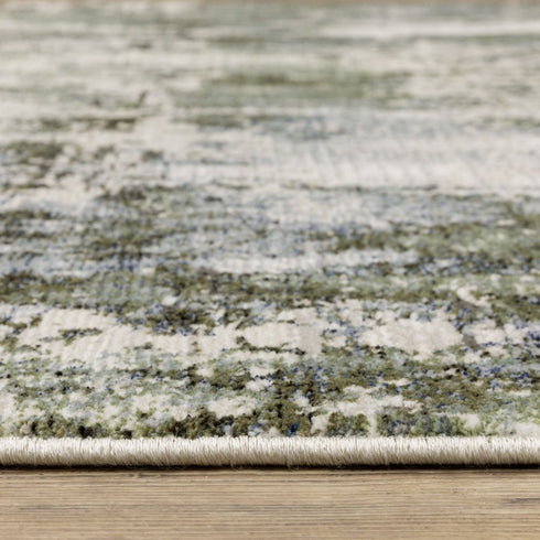 5' X 8' Green Blue Grey Ivory And Brown Abstract Power Loom Stain Resistant Area Rug