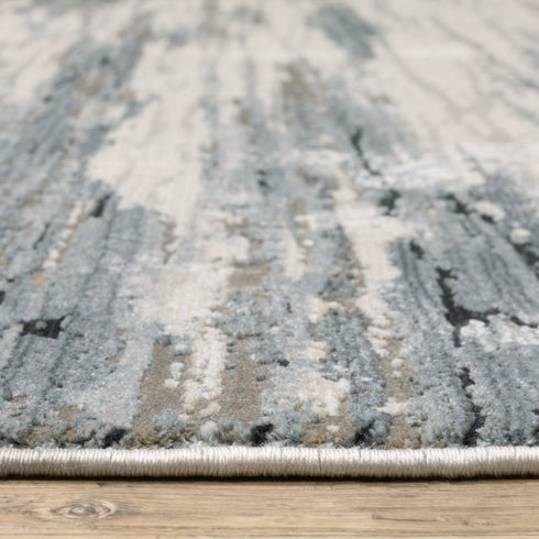 8' X 11' Blue Grey Beige And Brown Abstract Power Loom Stain Resistant Area Rug