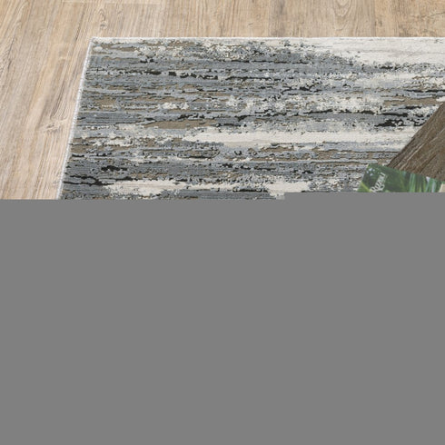 8' X 11' Blue Grey Beige And Brown Abstract Power Loom Stain Resistant Area Rug