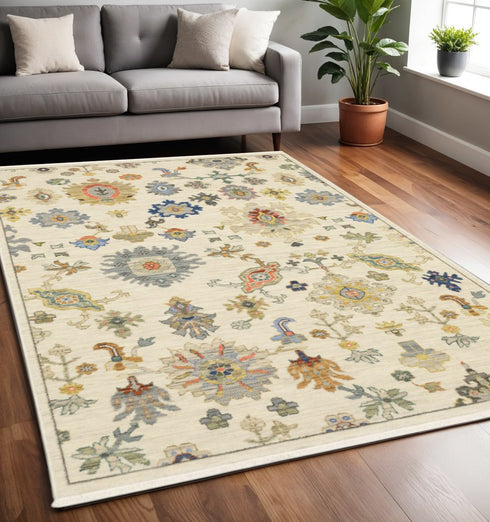 8' X 11' Ivory Beige Gold Grey Blue Pink Red Rust And Green Oriental Power Loom Stain Resistant Area Rug With Fringe