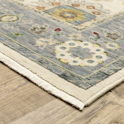 8' X 11' Ivory Blue Grey Teal Gold Green And Rust Oriental Power Loom Stain Resistant Area Rug With Fringe