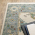 8' X 11' Ivory Blue Grey Teal Gold Green And Rust Oriental Power Loom Stain Resistant Area Rug With Fringe