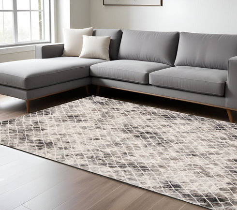 5' X 8' Ivory Gray And Taupe Abstract Stain Resistant Area Rug