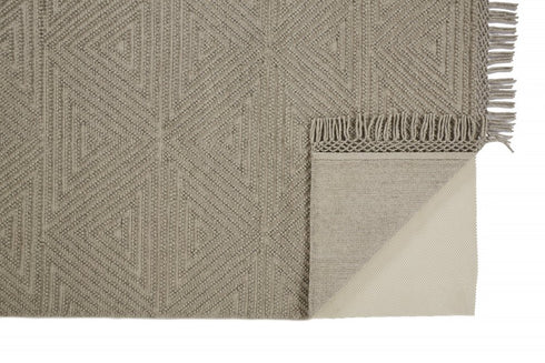 8' X 10' Tan and Ivory Wool Geometric Hand Woven Area Rug With Fringe