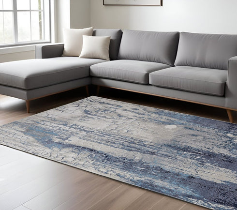 8' X 10' Ivory and Blue Abstract Power Loom Distressed Non Skid Area Rug