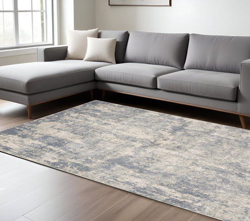 8' X 10' Light Gray Blue And Ivory Abstract Area Rug