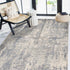 8' X 10' Light Gray Blue And Ivory Abstract Area Rug
