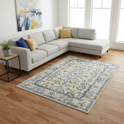 9' X 12' Ivory And Yellow Oriental Distressed Area Rug