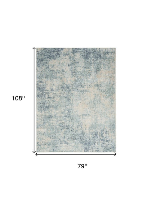 7' X 9' Blue And Ivory Abstract Washable Area Rug