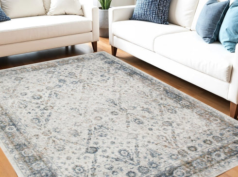 8' X 10' Blue and Ivory Floral Medallion Power Loom Distressed Washable Area Rug