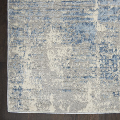 8' X 10' Ivory Blue And Gray Abstract Distressed Area Rug