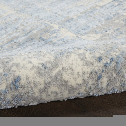 8' X 10' Ivory Blue And Gray Abstract Distressed Area Rug