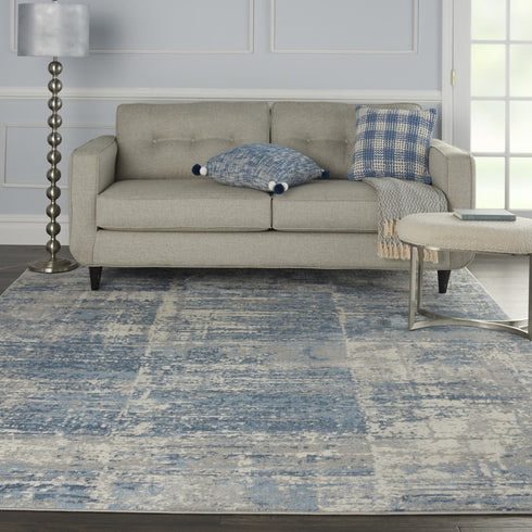 8' X 10' Ivory Blue And Gray Abstract Distressed Area Rug