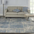 8' X 10' Ivory Blue And Gray Abstract Distressed Area Rug