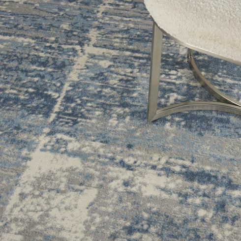 8' X 10' Ivory Blue And Gray Abstract Distressed Area Rug