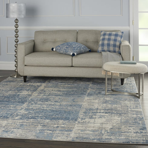 8' X 10' Ivory Blue And Gray Abstract Distressed Area Rug