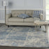 8' X 10' Ivory Blue And Gray Abstract Distressed Area Rug