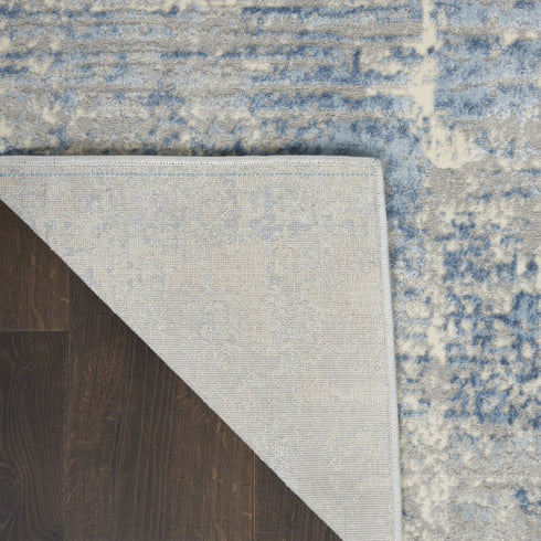 8' X 10' Ivory Blue And Gray Abstract Distressed Area Rug