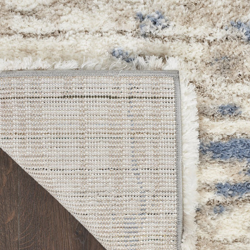 7' X 9' Light Blue Gray and Beige Abstract Shag Area Rug