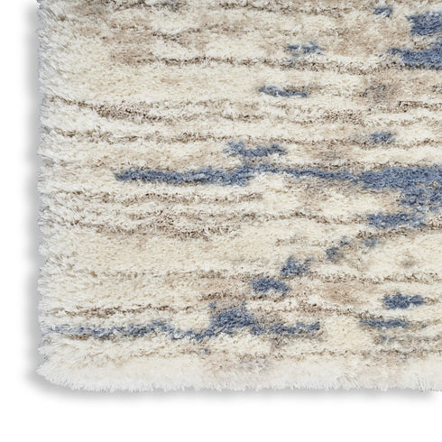 7' X 9' Light Blue Gray and Beige Abstract Shag Area Rug