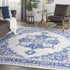 8' X 12' Ivory and Blue Floral Medallion Distressed Non Skid Area Rug