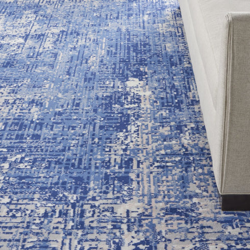 8' X 10' Ivory and Blue Abstract Distressed Area Rug