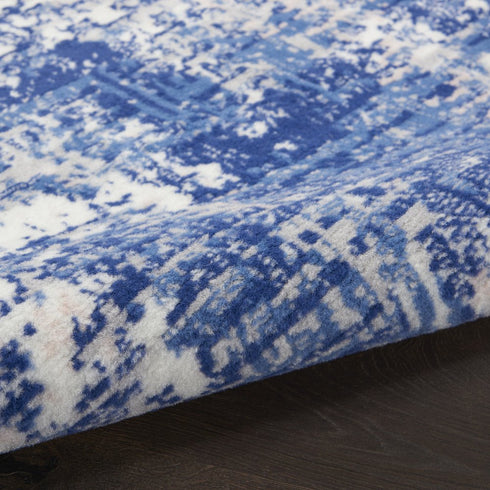 8' Ivory and Blue Abstract Distressed Round Rug