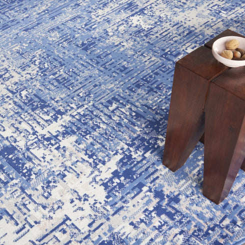 8' Ivory and Blue Abstract Distressed Round Rug