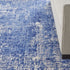 8' X 10' Ivory and Blue Abstract Distressed Area Rug