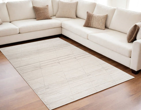 5' X 8' Cream and Beige Abstract Area Rug
