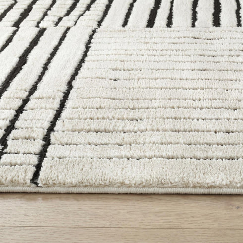 8' X 11' Cream and Black Abstract Distressed Area Rug