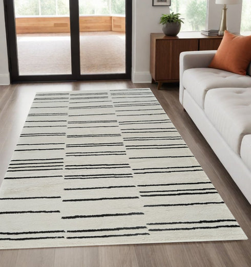 8' X 11' Cream and Black Abstract Distressed Area Rug