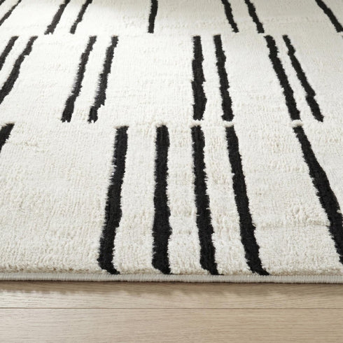8' X 11' Cream and Black Abstract Distressed Area Rug
