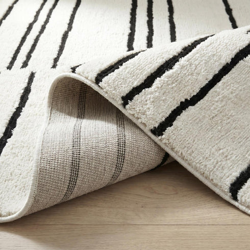 8' X 11' Cream and Black Abstract Distressed Area Rug