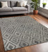 5' X 8' Black and Ivory Wool Abstract Geometric Hand Tufted Non Skid Area Rug
