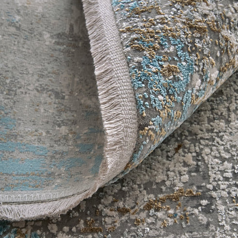8' X 11' Ivory Gray and Blue Abstract Power Loom Area Rug With Fringe