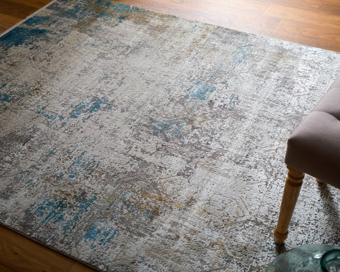 8' X 11' Ivory Gray and Blue Abstract Power Loom Area Rug With Fringe