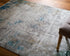 8' X 11' Ivory Gray and Blue Abstract Power Loom Area Rug With Fringe