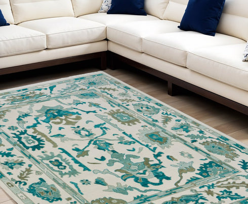 8' X 12' Green and Ivory Wool Floral Hand Knotted Area Rug With Fringe