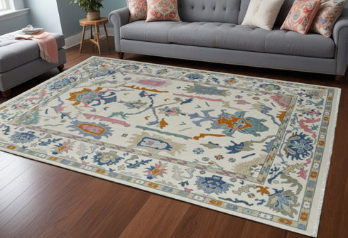 8' X 12' Blue Ivory and Pink Wool Floral Hand Knotted Area Rug With Fringe