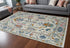 8' X 12' Blue Ivory and Pink Wool Floral Hand Knotted Area Rug With Fringe