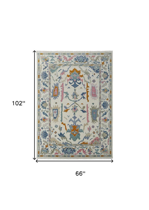 8' X 12' Blue Ivory and Pink Wool Floral Hand Knotted Area Rug With Fringe